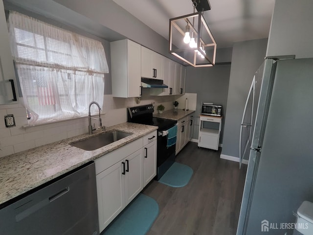 323 Gill Ln Unit 12Q, Iselin, NJ 08830 - kitchen featuring freestanding refrigerator, black range with electric stovetop, dishwashing machine, under cabinet range hood, and decorative backsplash