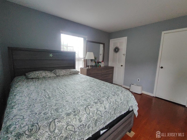 323 Gill Ln Unit 12Q, Iselin, NJ 08830 - bedroom featuring wood finished floors and baseboards