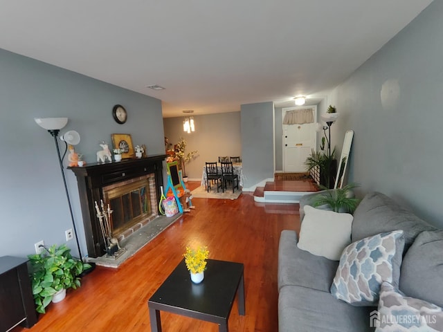 323 Gill Ln Unit 12Q, Iselin, NJ 08830 - living area with wood finished floors and a brick fireplace