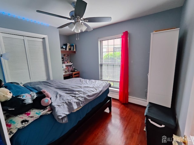 323 Gill Ln Unit 12Q, Iselin, NJ 08830 - bedroom featuring dark wood finished floors, a closet, a ceiling fan, and a baseboard radiator