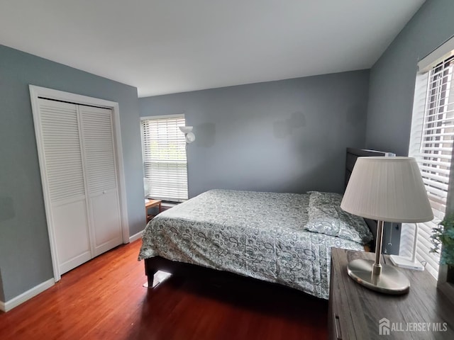 323 Gill Ln Unit 12Q, Iselin, NJ 08830 - bedroom featuring wood finished floors and a closet