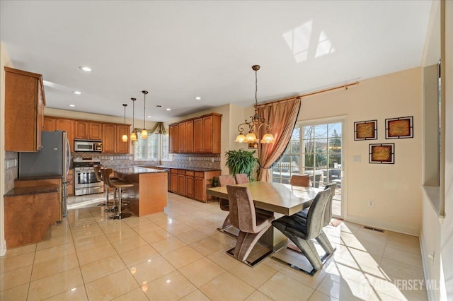 6 Lexington Ct, Monroe, NJ 08831 - dining area with healthy amount of natural light, a chandelier, light tile patterned floors, and recessed lighting