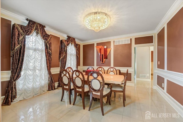 6 Lexington Ct, Monroe, NJ 08831 - dining room with a chandelier, a decorative wall, crown molding, light tile patterned floors, and wainscoting