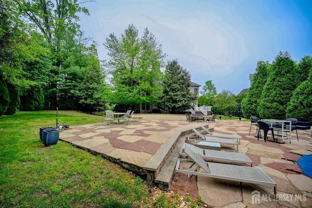 6 Lexington Ct, Monroe, NJ 08831 - view of property's community with a patio area and a lawn