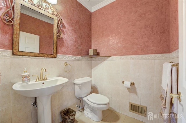 6 Lexington Ct, Monroe, NJ 08831 - bathroom featuring crown molding, tile walls, toilet, wainscoting, and a sink
