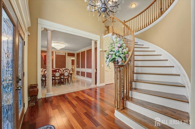 6 Lexington Ct, Monroe, NJ 08831 - foyer featuring a chandelier, wood-type flooring, stairway, and a high ceiling