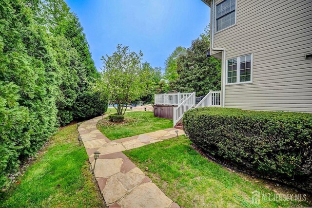 6 Lexington Ct, Monroe, NJ 08831 - view of grassy yard with a wooden deck
