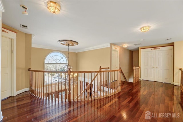 6 Lexington Ct, Monroe, NJ 08831 - hall featuring an upstairs landing, wood-type flooring, baseboards, and crown molding