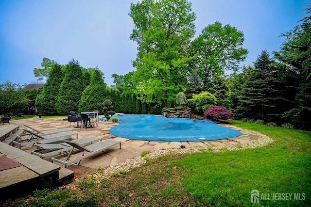 6 Lexington Ct, Monroe, NJ 08831 - swimming pool featuring a patio and a lawn