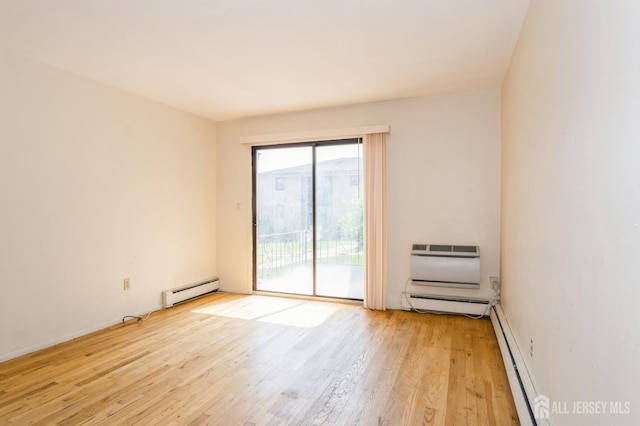 401 US Highway 22nd Rd Unit B8U1, North Plainfield, NJ 07060 - unfurnished room with a baseboard heating unit, light wood-style floors, and a wall mounted AC