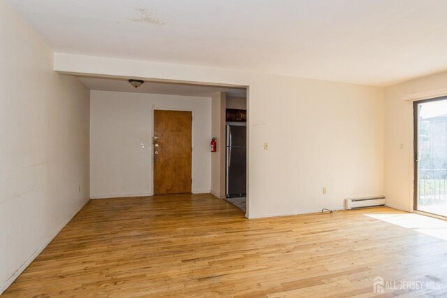 401 US Highway 22nd Rd Unit B8U1, North Plainfield, NJ 07060 - spare room with a baseboard radiator and light wood-type flooring