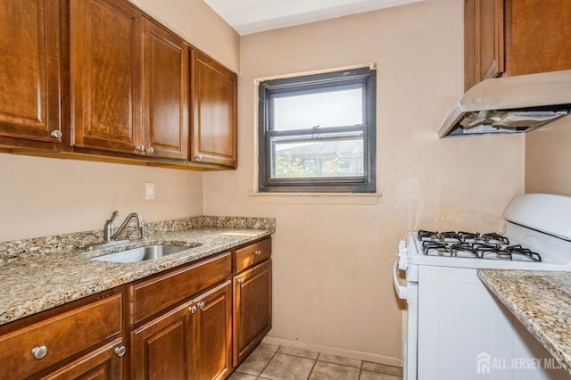 401 US Highway 22nd Rd Unit B8U1, North Plainfield, NJ 07060 - kitchen featuring white gas range oven, under cabinet range hood, light tile patterned floors, and light stone counters