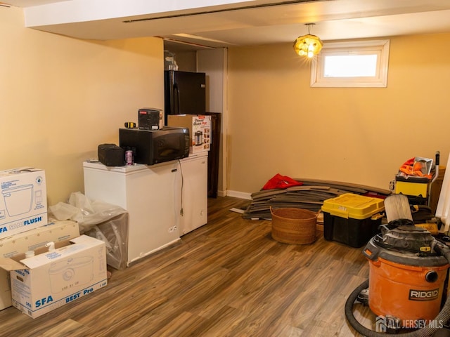 237 Cook Ave, Middlesex, NJ 08846 - below grade area with freestanding refrigerator and wood finished floors