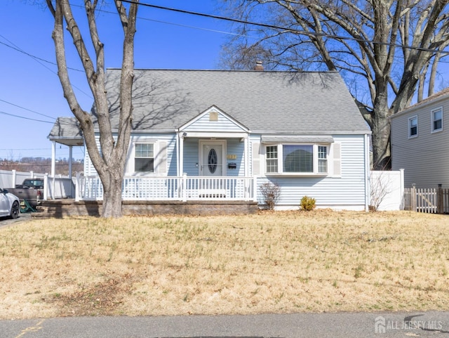 237 Cook Ave, Middlesex, NJ 08846 - cape cod house with fence, roof with shingles, a porch, a front yard, and a chimney