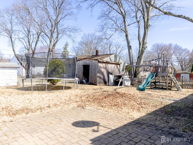 237 Cook Ave, Middlesex, NJ 08846 - view of yard with an outdoor structure, a trampoline, and a storage shed