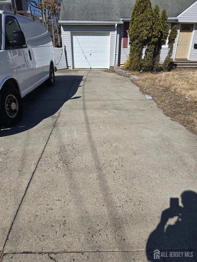 exterior space featuring concrete driveway