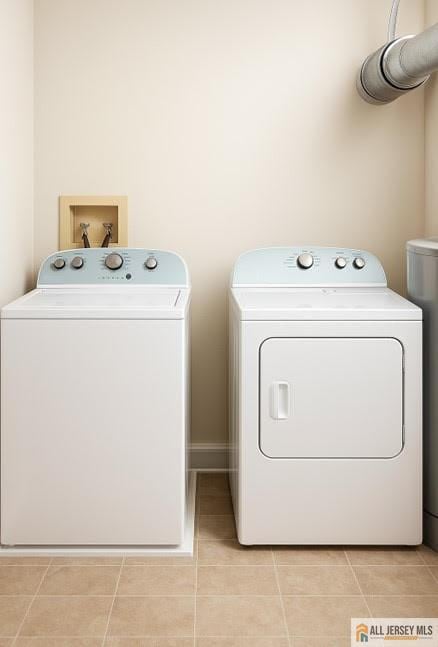 344 Danbury Ln Unit 344, East Brunswick, NJ 08816 - laundry room with washing machine and clothes dryer and light tile patterned flooring