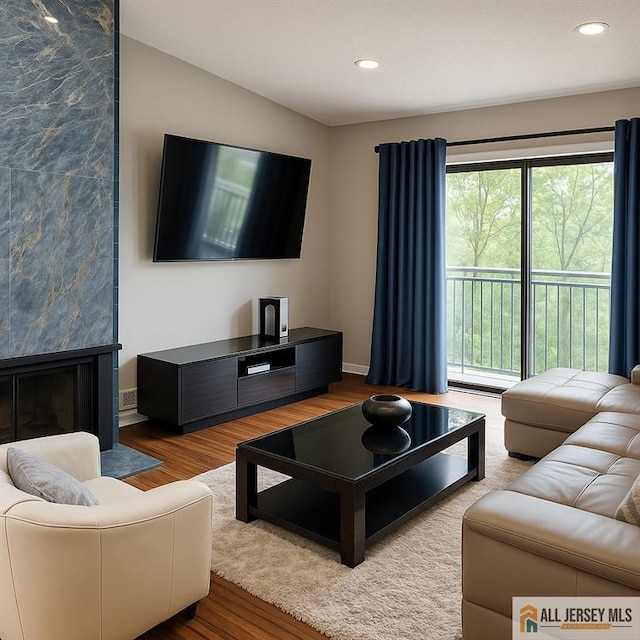 344 Danbury Ln Unit 344, East Brunswick, NJ 08816 - living room featuring wood finished floors, recessed lighting, and a fireplace