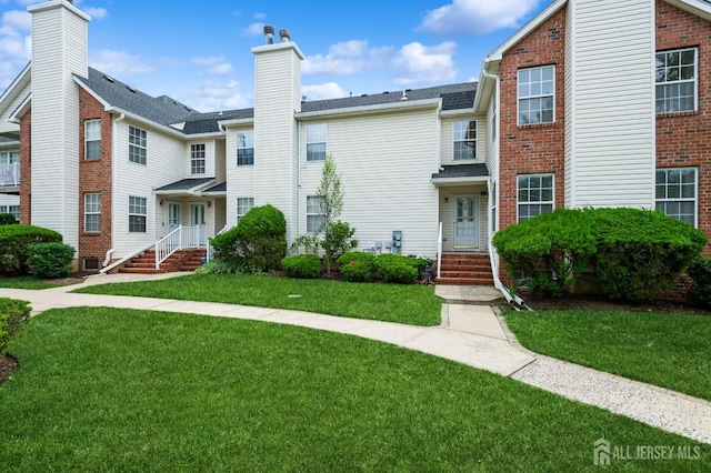 170 Vasser Dr, Piscataway, NJ 08854 - view of front of house with a front lawn, a chimney, and brick siding