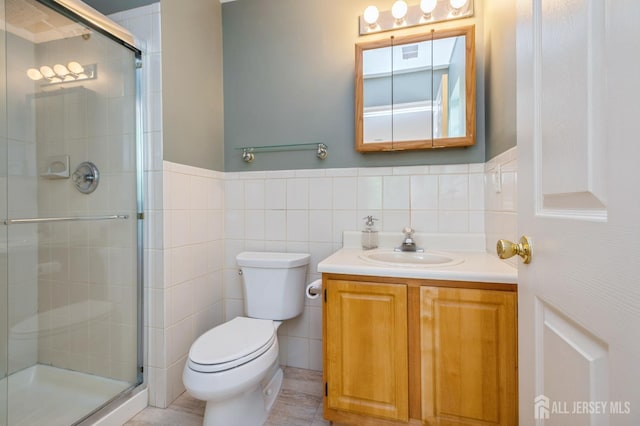 170 Vasser Dr, Piscataway, NJ 08854 - full bathroom featuring vanity, a shower stall, tile walls, and wainscoting