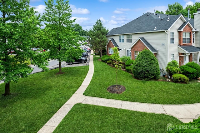 170 Vasser Dr, Piscataway, NJ 08854 - view of side of property with a lawn, roof with shingles, and brick siding