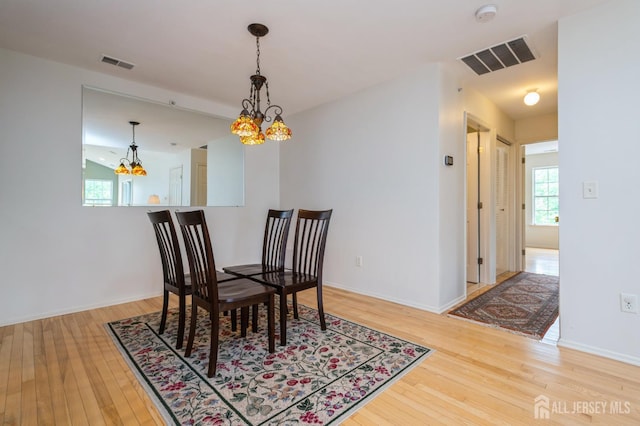 170 Vasser Dr, Piscataway, NJ 08854 - dining room with a chandelier, wood-type flooring, and plenty of natural light