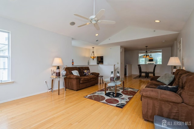 170 Vasser Dr, Piscataway, NJ 08854 - living room with wood finished floors, lofted ceiling, ceiling fan, recessed lighting, and a chandelier