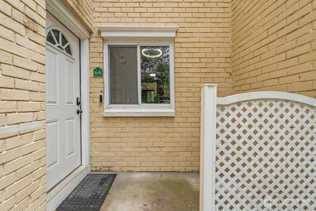 19 Lake Ave Unit 6A, East Brunswick, NJ 08816 - view of exterior entry featuring brick siding and a gate