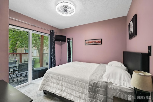 19 Lake Ave Unit 6A, East Brunswick, NJ 08816 - bedroom with access to exterior, carpet flooring, and a textured ceiling