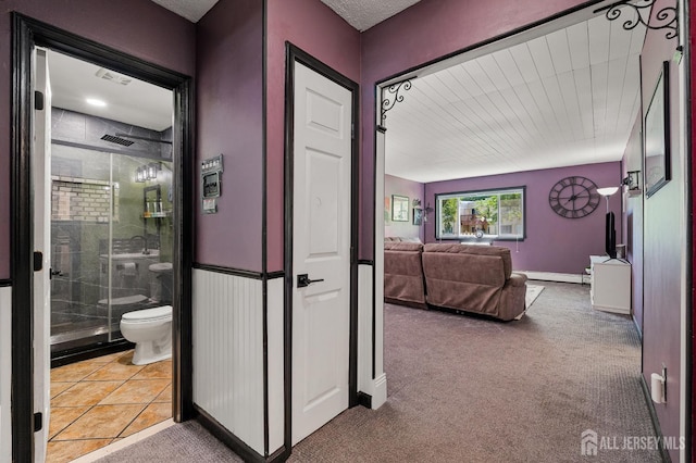 19 Lake Ave Unit 6A, East Brunswick, NJ 08816 - corridor featuring baseboard heating and carpet