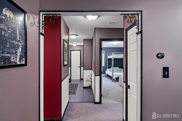 19 Lake Ave Unit 6A, East Brunswick, NJ 08816 - corridor with carpet flooring, a textured ceiling, and tile patterned floors