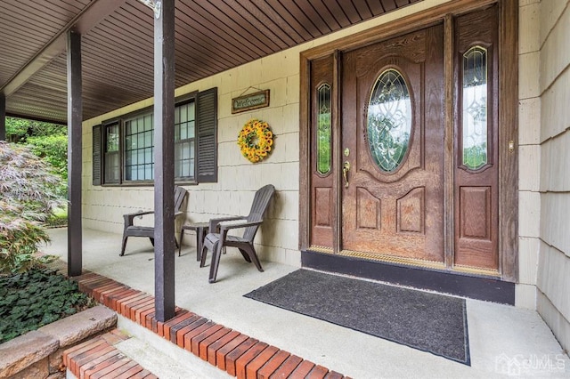 property entrance with covered porch