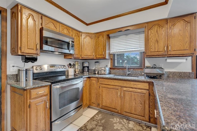 kitchen with sink, ornamental molding, light tile patterned floors, and range with electric stovetop
