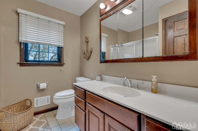 bathroom featuring tile patterned floors, vanity, and toilet