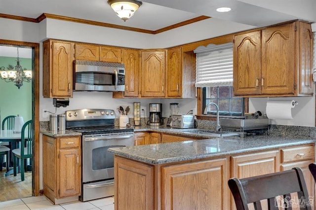 kitchen with sink, stone counters, stainless steel appliances, and ornamental molding
