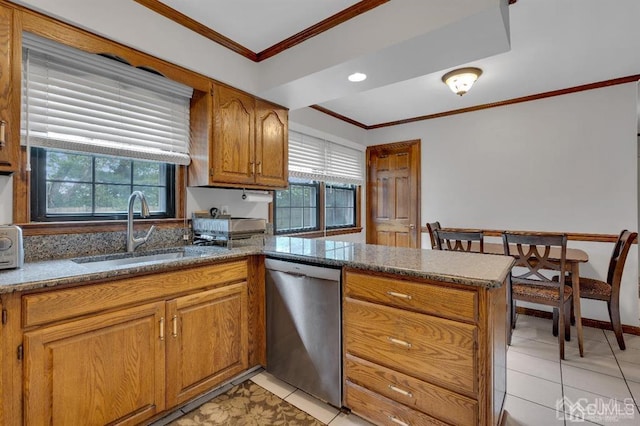 kitchen with dishwasher, a healthy amount of sunlight, crown molding, and light tile patterned floors