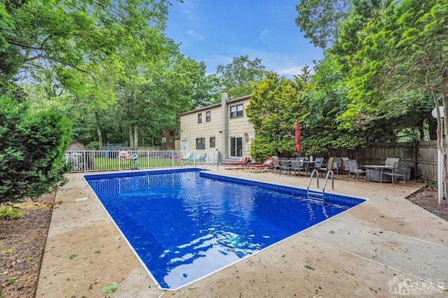 view of pool featuring a patio