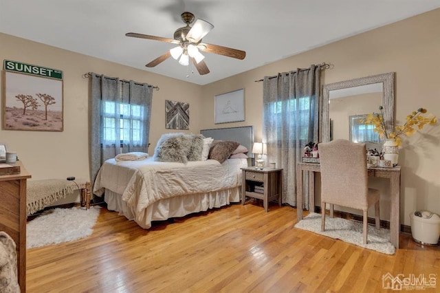 bedroom featuring ceiling fan and hardwood / wood-style flooring
