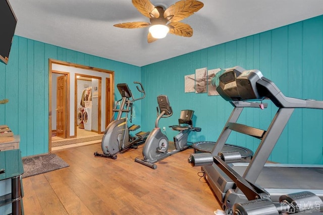 exercise room with hardwood / wood-style flooring and ceiling fan