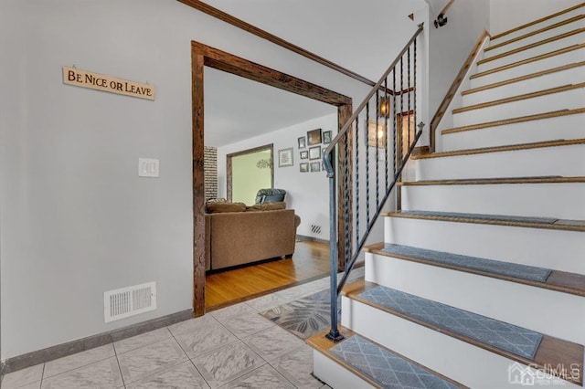 staircase with light wood-type flooring