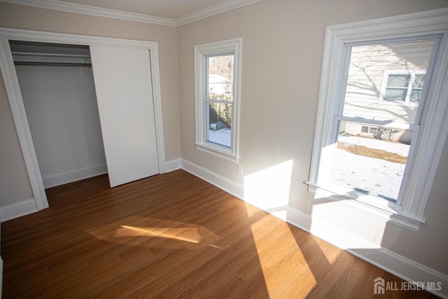 35 Red Bank Rd, Spotswood, NJ 08884 - unfurnished bedroom with wood finished floors, crown molding, and a closet