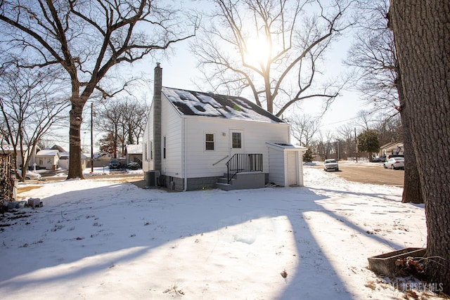 35 Red Bank Rd, Spotswood, NJ 08884 - snow covered property with a chimney
