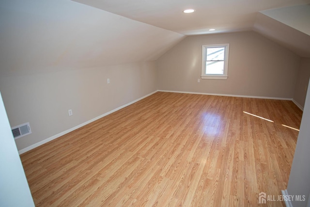 35 Red Bank Rd, Spotswood, NJ 08884 - additional living space with light wood finished floors, lofted ceiling, and recessed lighting