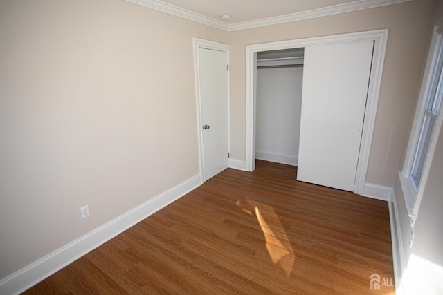 35 Red Bank Rd, Spotswood, NJ 08884 - unfurnished bedroom featuring wood finished floors, crown molding, and a closet