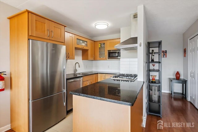150 Overlook Ave Unit 15E, Hackensack, NJ 07601 - kitchen featuring appliances with stainless steel finishes, wall chimney exhaust hood, decorative backsplash, a peninsula, and glass insert cabinets