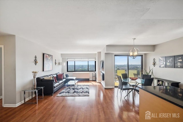 150 Overlook Ave Unit 15E, Hackensack, NJ 07601 - living room featuring wood finished floors and a chandelier