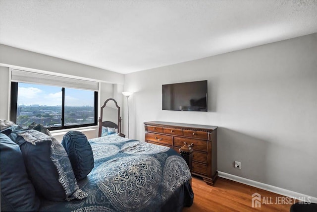 150 Overlook Ave Unit 15E, Hackensack, NJ 07601 - bedroom with wood finished floors and baseboards