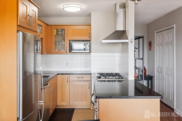 150 Overlook Ave Unit 15E, Hackensack, NJ 07601 - kitchen featuring wall chimney range hood, stainless steel appliances, a peninsula, and tasteful backsplash