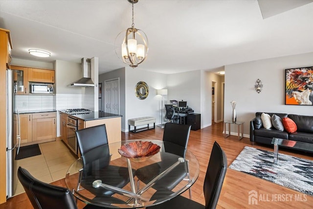 150 Overlook Ave Unit 15E, Hackensack, NJ 07601 - dining space with light wood finished floors and a chandelier