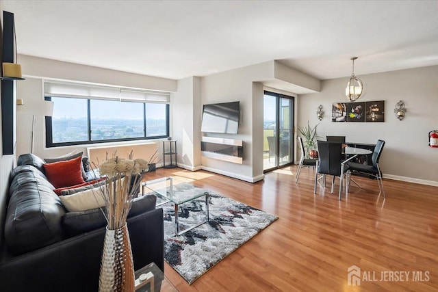 150 Overlook Ave Unit 15E, Hackensack, NJ 07601 - living area with a chandelier and wood finished floors